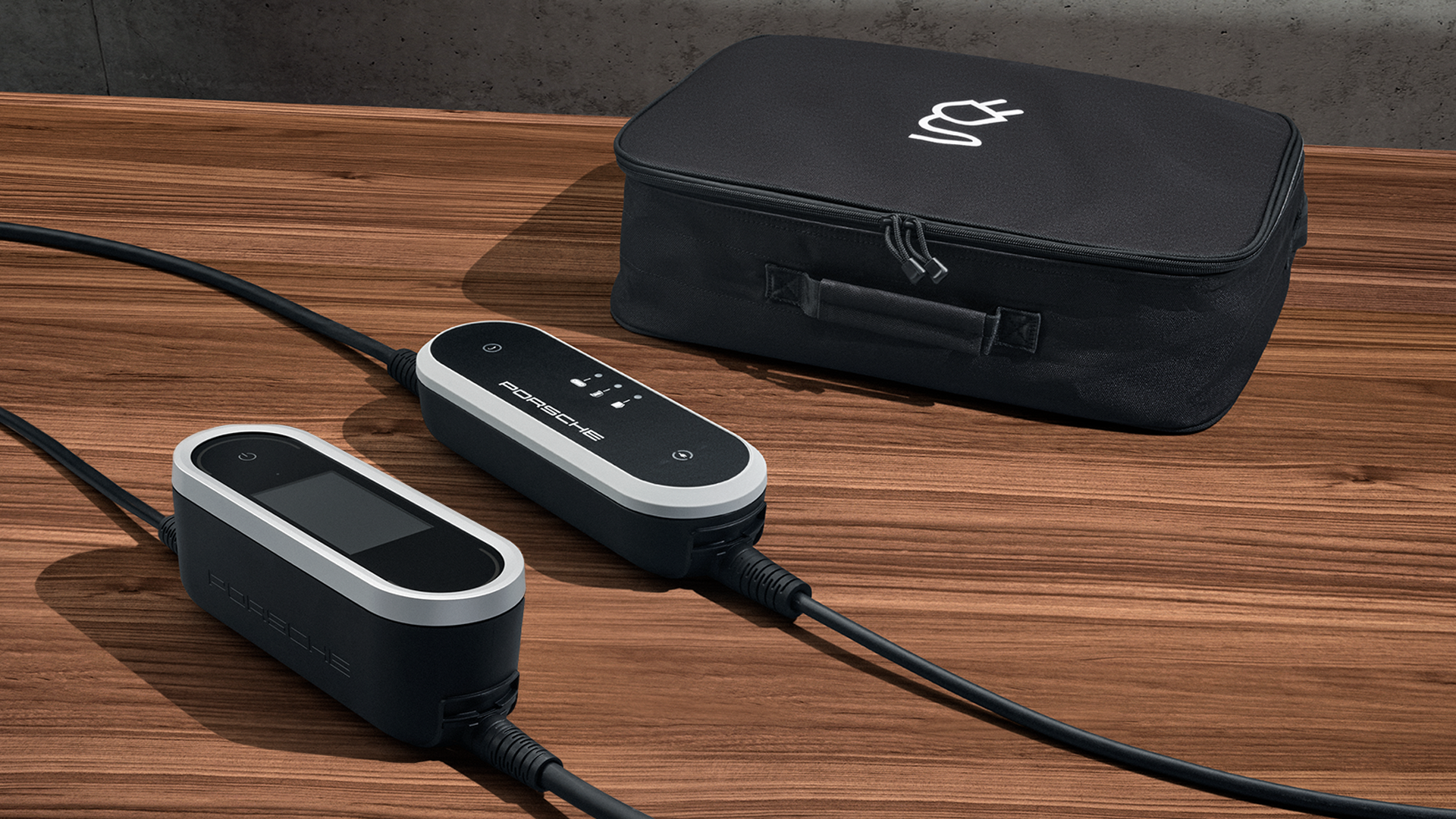Porsche mobile EV charger with portable carrying case, designed for flexible electric car charging at home or on the go. Premium portable charging solution for luxury electric vehicles, combining smart design and sustainable mobility.