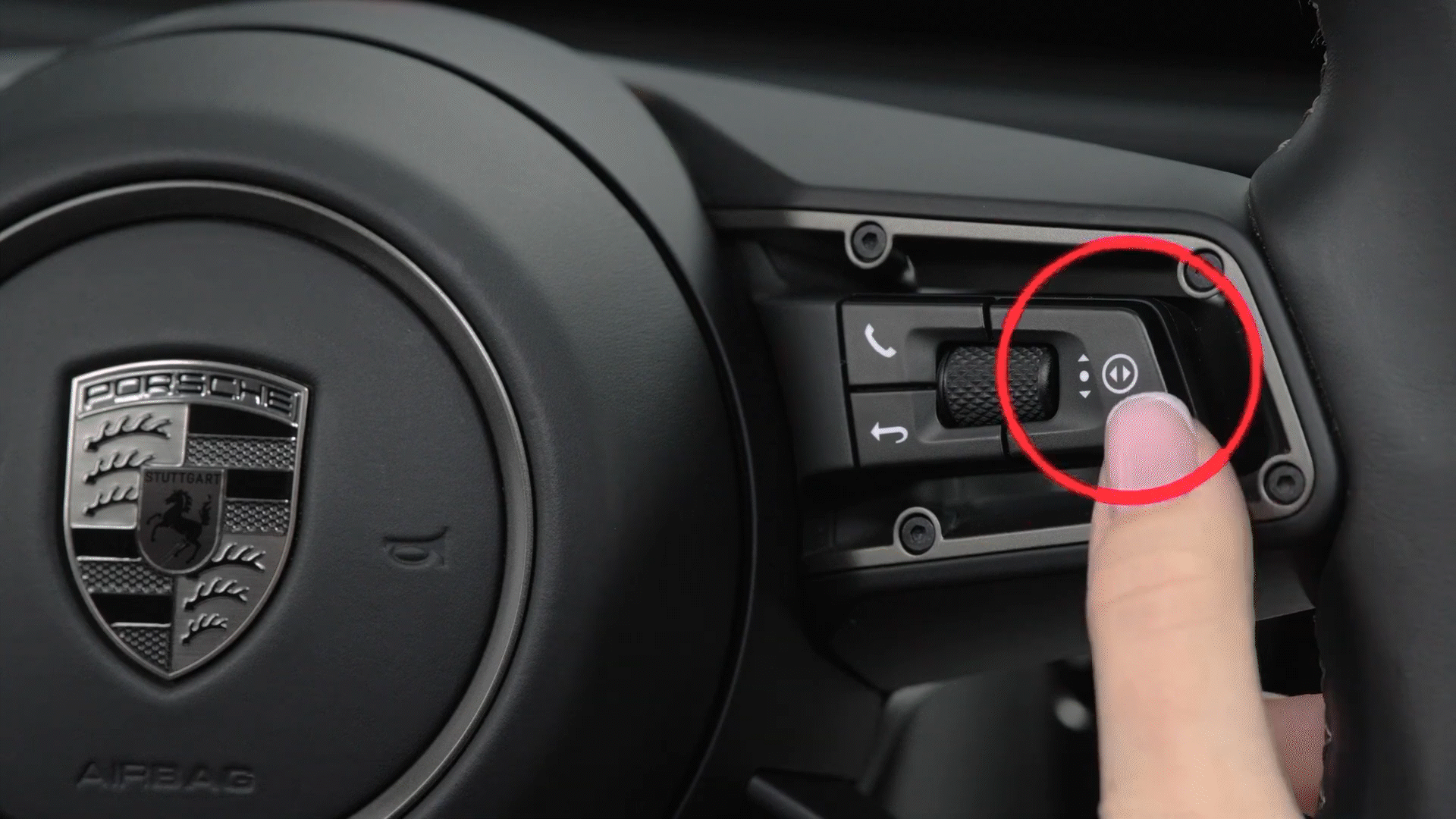 Steering wheel media control button in the Macan Electric.