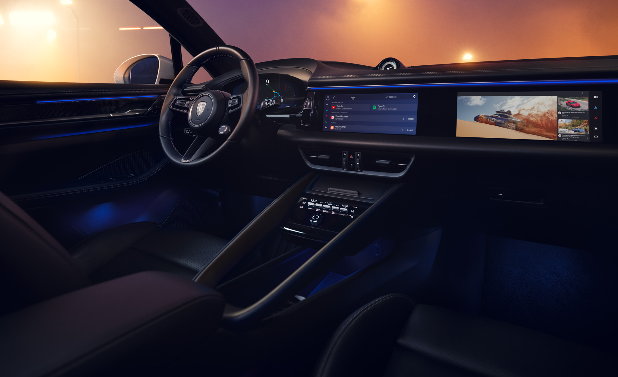 Close-up of the interior of a Macan Electric with the passenger display switched on and a city at night in the background.