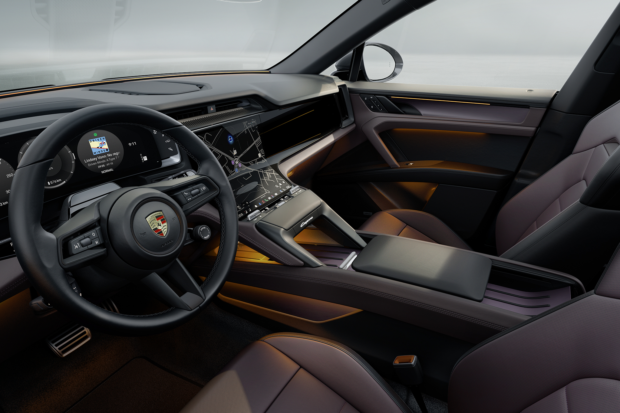 Interior view of the Porsche Cayenne Electric, showing the driver’s cockpit with curved digital instrument cluster, central touchscreen, steering wheel and ambient interior lighting.