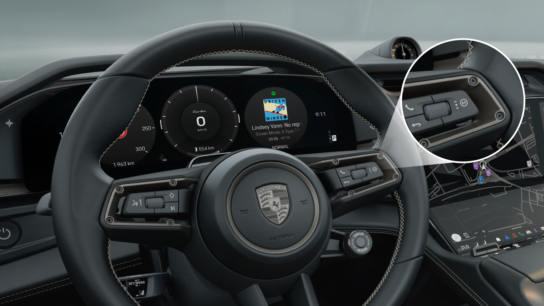 Porsche steering wheel with the right rotary toggle button highlighted.