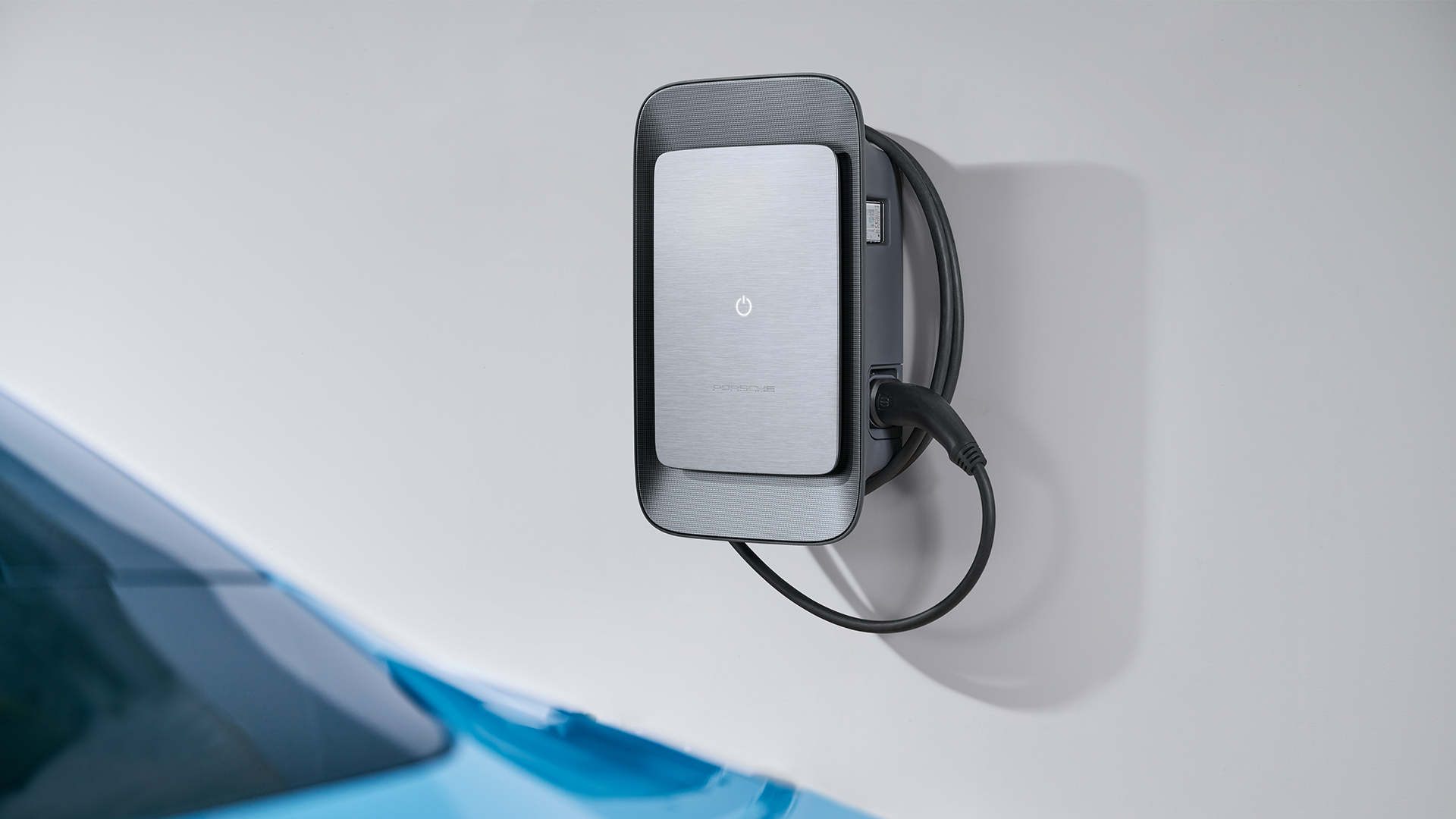Porsche wallbox EV charger mounted in modern home garage, designed for efficient electric car charging. Premium home charging solution combining sleek design, smart technology, and sustainable electric mobility.
