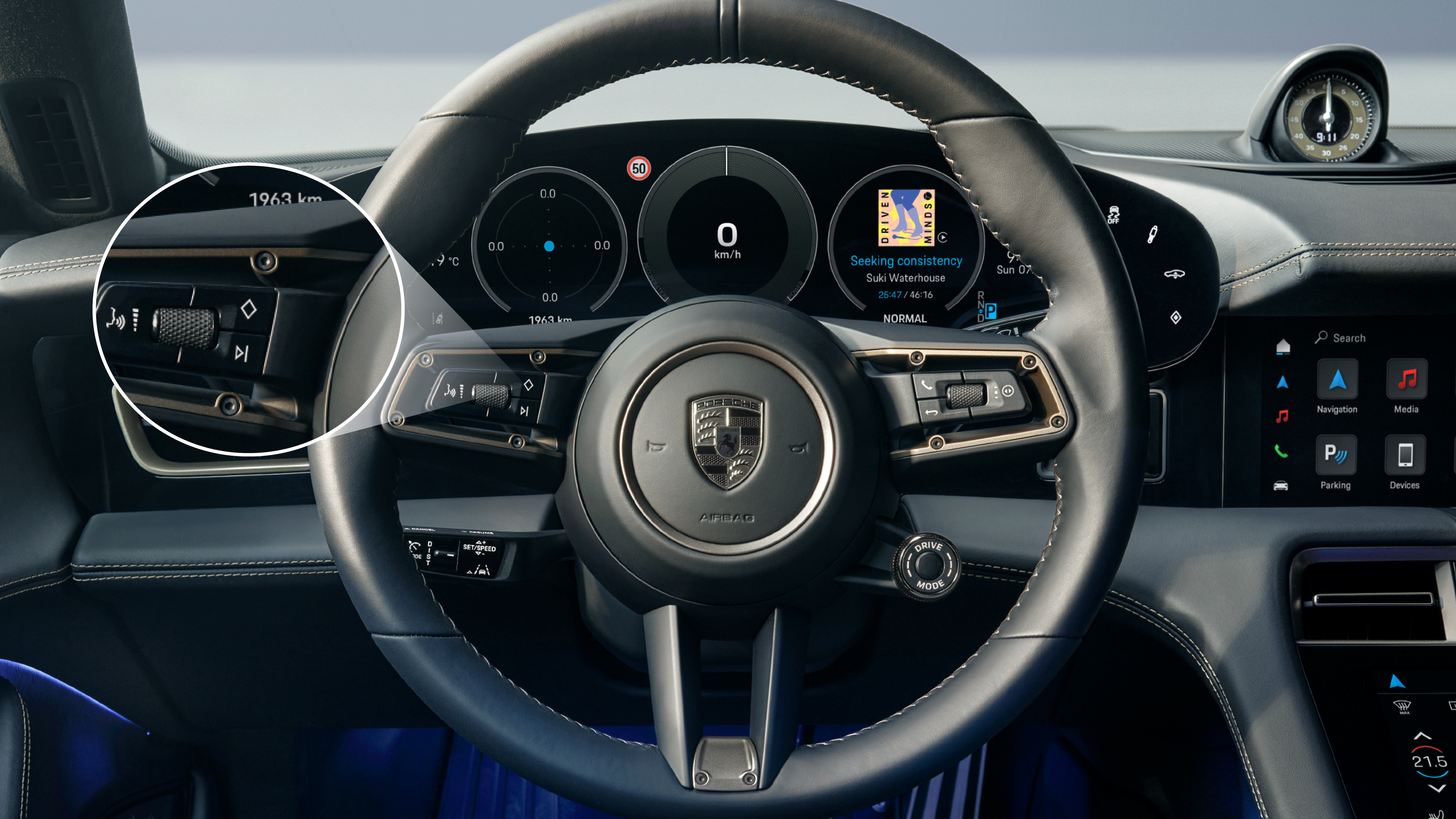 Porsche Taycan steering wheel with the Joker button highlighted.